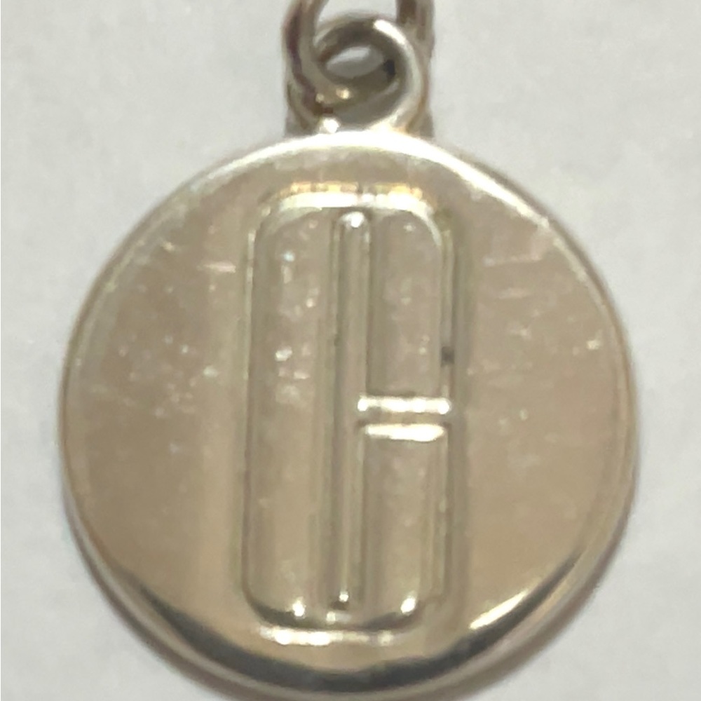 Tiffany & Co Clinique pendent charm